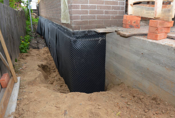 SJ Waterproofing Pros technician performing targeted Sump Pump Installation assessment in Melville, NY